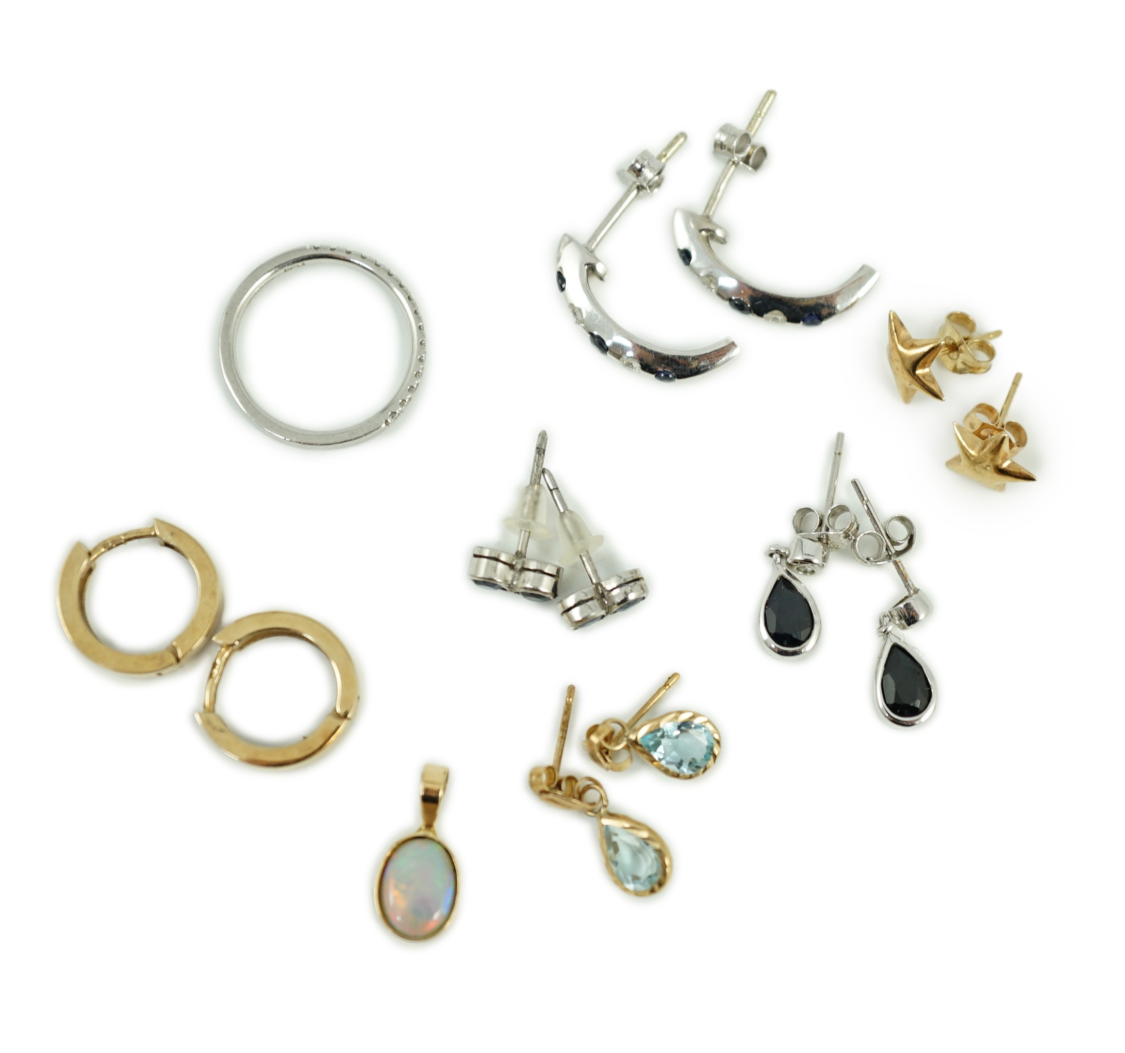 Three assorted modern 9ct earrings including sapphire and diamond chip set half hoop, gross 6.3 grams, three other white or yellow metal pairs, gross 2.6 grams, a small 14k and white opal doublet? set pendant, gross 0.5